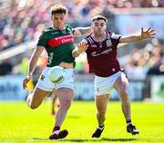 4 May 2025; Jordan Flynn of Mayo in action against Seán Mulkerrin of Galway during the Connacht GAA Football Senior Championship final match between Mayo and Galway at Hastings Insurance MacHale Park in Castlebar, Mayo. Photo by Seb Daly/Sportsfile