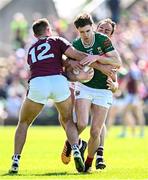 4 May 2025; Sam Callinan of Mayo is tackled by Galway players Cillian McDaid, left, and John Maher during the Connacht GAA Football Senior Championship final match between Mayo and Galway at Hastings Insurance MacHale Park in Castlebar, Mayo. Photo by Seb Daly/Sportsfile