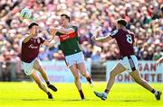 4 May 2025; Matthew Ruane of Mayo in action against Galway players Seán Kelly, left, and Dylan Thornton during the Connacht GAA Football Senior Championship final match between Mayo and Galway at Hastings Insurance MacHale Park in Castlebar, Mayo. Photo by Seb Daly/Sportsfile