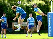 5 May 2025; John McKee, left, and Thomas Clarkson during Leinster Rugby squad training at UCD in Dublin. Photo by Seb Daly/Sportsfile