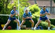 5 May 2025; Leinster players, from left, Garry Ringrose, Ross Byrne and James Lowe during Leinster Rugby squad training at UCD in Dublin. Photo by Seb Daly/Sportsfile