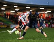2 May 2025; Danny Mullen of Derry City in action against Kameron Ledwidge of Shelbourne during the SSE Airtricity Men's Premier Division match between Derry City and Shelbourne at The Ryan McBride Brandywell Stadium in Derry. Photo by Stephen McCarthy/Sportsfile