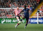 2 May 2025; Mipo Odubeko of Shelbourne in action against Mark Connolly of Derry City during the SSE Airtricity Men's Premier Division match between Derry City and Shelbourne at The Ryan McBride Brandywell Stadium in Derry. Photo by Stephen McCarthy/Sportsfile