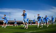 5 May 2025; Ryan Burke of Waterford, centre, and teammates warm-up before the SSE Airtricity Men's Premier Division match between Shelbourne and Waterford at Tolka Park in Dublin. Photo by Seb Daly/Sportsfile