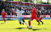5 May 2025; Ellis Chapman of Shelbourne in action against James Olayinka of Waterford during the SSE Airtricity Men's Premier Division match between Shelbourne and Waterford at Tolka Park in Dublin. Photo by Seb Daly/Sportsfile