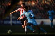 5 May 2025; Zach Elbouzedi of St Patrick's Athletic in action against Shane Ferguson of Derry City during the SSE Airtricity Men's Premier Division match between Derry City and St Patrick's Athletic at The Ryan McBride Brandywell Stadium in Derry. Photo by Stephen McCarthy/Sportsfile