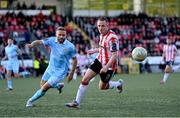 5 May 2025; Shane Ferguson of Derry City in action against Ryan McLaughlin of St Patrick's Athletic during the SSE Airtricity Men's Premier Division match between Derry City and St Patrick's Athletic at The Ryan McBride Brandywell Stadium in Derry. Photo by Stephen McCarthy/Sportsfile