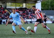 5 May 2025; Michael Duffy of Derry City in action against Jamie Lennon of St Patrick's Athletic during the SSE Airtricity Men's Premier Division match between Derry City and St Patrick's Athletic at The Ryan McBride Brandywell Stadium in Derry. Photo by Stephen McCarthy/Sportsfile