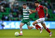 5 May 2025; Jack Byrne of Shamrock Rovers in action against Matty Wolfe of Sligo Rovers during the SSE Airtricity Men's Premier Division match between Shamrock Rovers and Sligo Rovers at Tallaght Stadium in Dublin. Photo by David Fitzgerald/Sportsfile