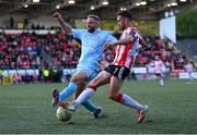 5 May 2025; Michael Duffy of Derry City in action against Ryan McLaughlin of St Patrick's Athletic during the SSE Airtricity Men's Premier Division match between Derry City and St Patrick's Athletic at The Ryan McBride Brandywell Stadium in Derry. Photo by Stephen McCarthy/Sportsfile