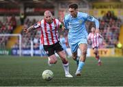 5 May 2025; Mason Melia of St Patrick's Athletic in action against Mark Connolly of Derry City during the SSE Airtricity Men's Premier Division match between Derry City and St Patrick's Athletic at The Ryan McBride Brandywell Stadium in Derry. Photo by Stephen McCarthy/Sportsfile