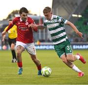 5 May 2025; Michael Noonan of Shamrock Rovers in action against Ronan Manning of Sligo Rovers during the SSE Airtricity Men's Premier Division match between Shamrock Rovers and Sligo Rovers at Tallaght Stadium in Dublin. Photo by David Fitzgerald/Sportsfile