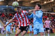 5 May 2025; Ronan Boyce of Derry City in action against Kian Leavy of St Patrick's Athletic during the SSE Airtricity Men's Premier Division match between Derry City and St Patrick's Athletic at The Ryan McBride Brandywell Stadium in Derry. Photo by Stephen McCarthy/Sportsfile