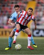 5 May 2025; Ronan Boyce of Derry City in action against Anto Breslin of St Patrick's Athletic during the SSE Airtricity Men's Premier Division match between Derry City and St Patrick's Athletic at The Ryan McBride Brandywell Stadium in Derry. Photo by Stephen McCarthy/Sportsfile