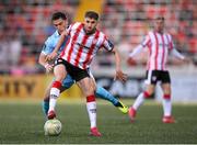 5 May 2025; Ronan Boyce of Derry City in action against Anto Breslin of St Patrick's Athletic during the SSE Airtricity Men's Premier Division match between Derry City and St Patrick's Athletic at The Ryan McBride Brandywell Stadium in Derry. Photo by Stephen McCarthy/Sportsfile