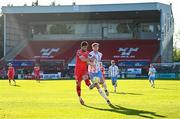 5 May 2025; Sam Bone of Shelbourne in action against Maarten Pouwels of Waterford during the SSE Airtricity Men's Premier Division match between Shelbourne and Waterford at Tolka Park in Dublin. Photo by Seb Daly/Sportsfile