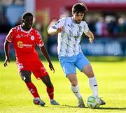 5 May 2025; Ryan Burke of Waterford in action against Mipo Odubeko of Shelbourne during the SSE Airtricity Men's Premier Division match between Shelbourne and Waterford at Tolka Park in Dublin. Photo by Seb Daly/Sportsfile