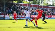 5 May 2025; Ellis Chapman of Shelbourne in action against James Olayinka of Waterford during the SSE Airtricity Men's Premier Division match between Shelbourne and Waterford at Tolka Park in Dublin. Photo by Seb Daly/Sportsfile