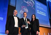 6 May 2025; Tom Rehill, representing St Mary's Edenderry in Offaly, is presented with the Best Menswear Development School Award by Best Menswear E-commerce Manager Lyndsey Clancy, right, and Leinster Rugby president Declan Gardiner during the Leinster Rugby awards ball 2025 at O'Reilly Hall in UCD, Dublin. Photo by Brendan Moran/Sportsfile