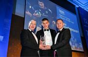 6 May 2025; Sam Prendergast is presented with the Laya Healthcare Men’s Young Player of the Year award by D.O. O'Connor of Laya Healthcare, right, and Leinster Rugby president Declan Gardiner during the Leinster Rugby awards ball 2025 at O'Reilly Hall in UCD, Dublin. Photo by Brendan Moran/Sportsfile