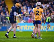 27 April 2025; Clare goalkeeper Eibhear Quilligan tries to untangle the orange grip from the broken hurl of Dessie Hutchinson that wrapped around his own hurl during the Munster GAA Hurling Senior Championship Round 2 match between Waterford and Clare at Walsh Park in Waterford. Photo by Piaras Ó Mídheach/Sportsfile