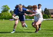 9 May 2025; Andrew Osborne of Leinster A holds off Owen O'Kane of Ulster A on his way to scoring his side's third try during the Interprovincial &quot;A&quot; Rugby match between Leinster A and Ulster A at Castle Avenue in Dublin. Photo by Piaras Ó Mídheach/Sportsfile