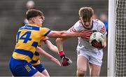 9 May 2025; Mayo goalkeeper Thomas Williams is tackled by Shay McGuinness, 14, and John Price of Roscommon during the Electric Ireland Connacht GAA Football Minor Championship final match between Roscommon and Mayo at Hastings Insurance MacHale Park in Castlebar, Mayo. Photo by Ben McShane/Sportsfile