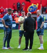 9 May 2025; Munsterdefence coach Denis Leamy, left, lead performance analyst and technical coach George Murray and interim head coach Ian Costello in conversation with Ulster head coach Richie Murphy before the United Rugby Championship match between Munster and Ulster at Thomond Park in Limerick. Photo by Brendan Moran/Sportsfile