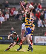 9 May 2025; John Price of Roscommon and Barry Langan of Mayo contest a high-ball during the Electric Ireland Connacht GAA Football Minor Championship final match between Roscommon and Mayo at Hastings Insurance MacHale Park in Castlebar, Mayo. Photo by Ben McShane/Sportsfile