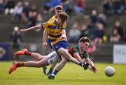 9 May 2025; John Price of Roscommon scores his side's first goal despite the attempts of Barry Langan of Mayo during the Electric Ireland Connacht GAA Football Minor Championship final match between Roscommon and Mayo at Hastings Insurance MacHale Park in Castlebar, Mayo. Photo by Ben McShane/Sportsfile