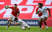 9 May 2025; Diarmuid Kilgallen of Munster is tackled by Nick Timoney of Ulster during the United Rugby Championship match between Munster and Ulster at Thomond Park in Limerick. Photo by Brendan Moran/Sportsfile
