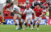 9 May 2025; Jude Postlethwaite of Ulster is tackled by Tom Farrell of Munster during the United Rugby Championship match between Munster and Ulster at Thomond Park in Limerick. Photo by John Dickson/Sportsfile