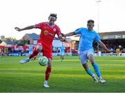 9 May 2025; Harry Wood of Shelbourne in action against Jamie Lennon of St Patrick's Athletic during the SSE Airtricity Men's Premier Division match between Shelbourne and St Patrick's Athletic at Tolka Park in Dublin. Photo by Stephen McCarthy/Sportsfile