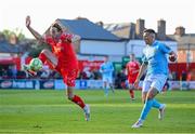 9 May 2025; Harry Wood of Shelbourne in action against Jamie Lennon of St Patrick's Athletic during the SSE Airtricity Men's Premier Division match between Shelbourne and St Patrick's Athletic at Tolka Park in Dublin. Photo by Stephen McCarthy/Sportsfile