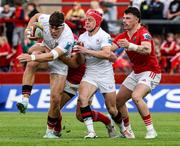 9 May 2025; John Hodnett of Munster is tackled by Cormac Izuchukwu of Ulster during the United Rugby Championship match between Munster and Ulster at Thomond Park in Limerick. Photo by John Dickson/Sportsfile
