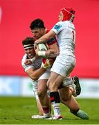 9 May 2025; Calvin Nash of Munster /isb Jude Postlethwaite and Michael Lowry of Ulster during the United Rugby Championship match between Munster and Ulster at Thomond Park in Limerick. Photo by Brendan Moran/Sportsfile
