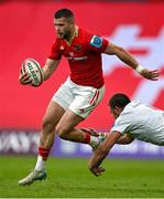 9 May 2025; Diarmuid Kilgallen of Munster beats the tackle of Iain Henderson of Ulster during the United Rugby Championship match between Munster and Ulster at Thomond Park in Limerick. Photo by Brendan Moran/Sportsfile