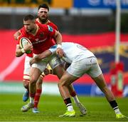 9 May 2025; Diarmuid Kilgallen of Munster is tackled by Jacob Stockdale of Ulster during the United Rugby Championship match between Munster and Ulster at Thomond Park in Limerick. Photo by Brendan Moran/Sportsfile