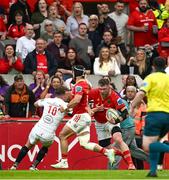 9 May 2025; Peter O'Mahony of Munster steps inside Jack Murphy of Ulster on the way to setting up his side's second try during the United Rugby Championship match between Munster and Ulster at Thomond Park in Limerick. Photo by Brendan Moran/Sportsfile