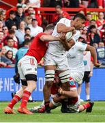 9 May 2025; Cormac Izuchukwu of Munster is tackled by Peter O’Mahony of Ulster during the United Rugby Championship match between Munster and Ulster at Thomond Park in Limerick. Photo by John Dickson/Sportsfile