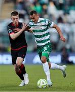 9 May 2025; Graham Burke of Shamrock Rovers in action against Warren Davis of Drogheda United during the SSE Airtricity Men's Premier Division match between Shamrock Rovers and Drogheda United at Tallaght Stadium in Dublin. Photo by Thomas Flinkow/Sportsfile