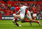 9 May 2025; Tadhg Beirne of Munster scores his side's third try despite the tackle of Jack Murphy of Ulster during the United Rugby Championship match between Munster and Ulster at Thomond Park in Limerick. Photo by Brendan Moran/Sportsfile