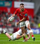9 May 2025; Alex Nankivell of Munster is tackled by Jude Postlethwaite of Ulster during the United Rugby Championship match between Munster and Ulster at Thomond Park in Limerick. Photo by Brendan Moran/Sportsfile
