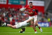 9 May 2025; Alex Nankivell of Munster is tackled by Jude Postlethwaite of Ulster during the United Rugby Championship match between Munster and Ulster at Thomond Park in Limerick. Photo by Brendan Moran/Sportsfile