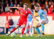 9 May 2025; Harry Wood of Shelbourne in action against Jamie Lennon of St Patrick's Athletic during the SSE Airtricity Men's Premier Division match between Shelbourne and St Patrick's Athletic at Tolka Park in Dublin. Photo by Stephen McCarthy/Sportsfile