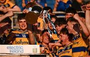 9 May 2025; Roscommon captain Dara Curran, centre, lifts the cup alongside his teammates after the Electric Ireland Connacht GAA Football Minor Championship final match between Roscommon and Mayo at Hastings Insurance MacHale Park in Castlebar, Mayo. Photo by Ben McShane/Sportsfile