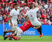 9 May 2025; Iain Henderson of Ulster is tackled by John Hodnett of munster during the United Rugby Championship match between Munster and Ulster at Thomond Park in Limerick. Photo by John Dickson/Sportsfile