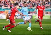 9 May 2025; Zach Elbouzedi of St Patrick's Athletic in action against Tyreke Wilson, left, and Kerr McInroy of Shelbourne during the SSE Airtricity Men's Premier Division match between Shelbourne and St Patrick's Athletic at Tolka Park in Dublin. Photo by Piaras Ó Mídheach/Sportsfile