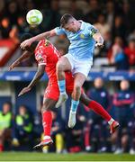 9 May 2025; Joe Redmond of St Patrick's Athletic in action against Mipo Odubeko of Shelbourne during the SSE Airtricity Men's Premier Division match between Shelbourne and St Patrick's Athletic at Tolka Park in Dublin. Photo by Stephen McCarthy/Sportsfile