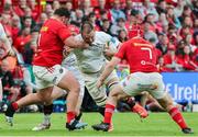 9 May 2025; Iain Henderson of Ulster is tackled by Michael Milne and John Hodnett of Munster during the United Rugby Championship match between Munster and Ulster at Thomond Park in Limerick. Photo by John Dickson/Sportsfile